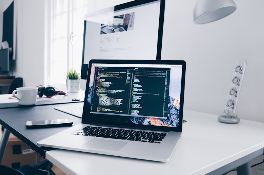 Developer workspace with laptop showing a modern landing page design
